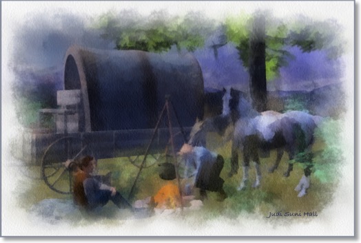 A scene from the old west with settlers and a covered wagon.