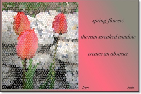 This haiga reads:</br>spring flowers</br>the rain streaked window</br>creates an abstract
