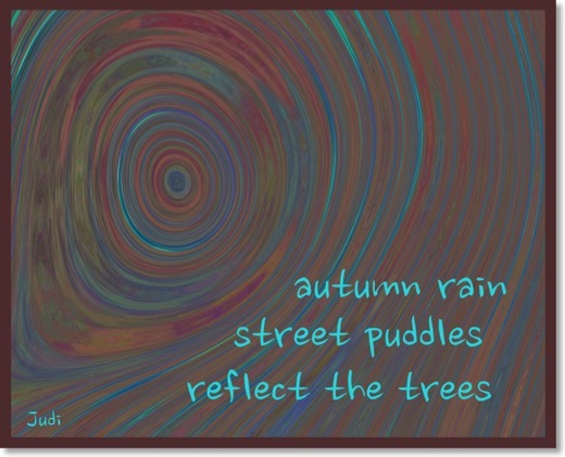 This haiga reads:</br>autumn rain</br>street puddles</br>reflect the rain
